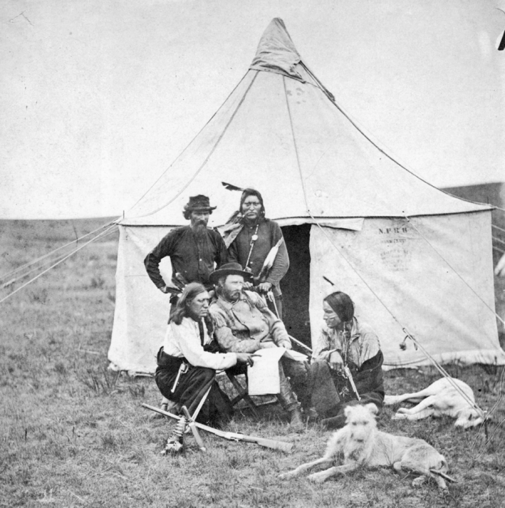 George Armstrong Custer (seated) on the 1874 Black Hills Expedition with a deerhound and sleeping greyhound. National Park Service, Little Bighorn Battlefield National Monument, LIBI_00011_004321. 